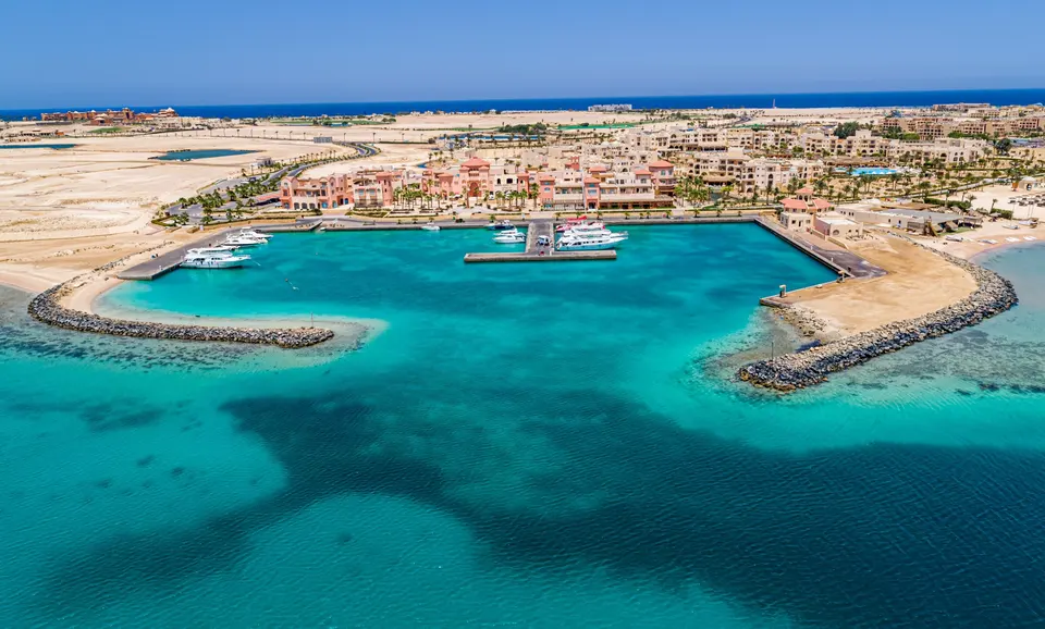 High-resolution aerial view across Somabay Marina and its turquoise sheltered basin