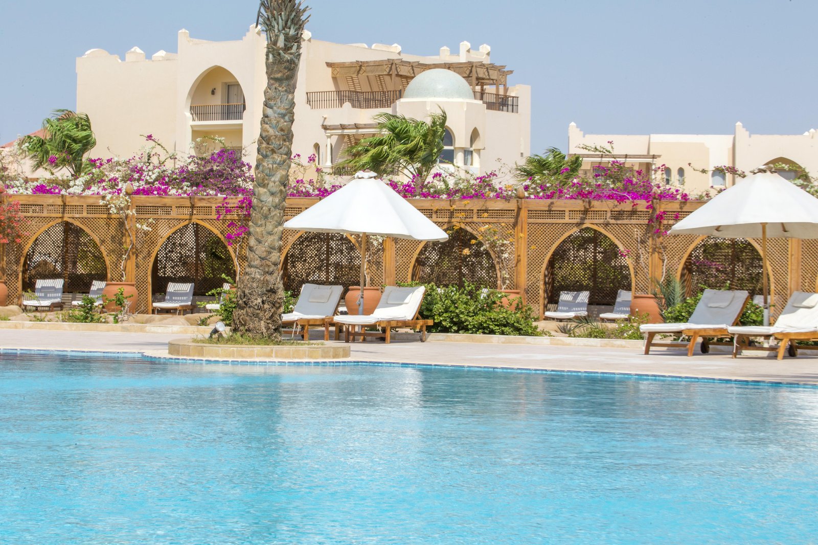 Lagoon-style swimming pool and landscaped terraces at Kempinski Hotel Somabay