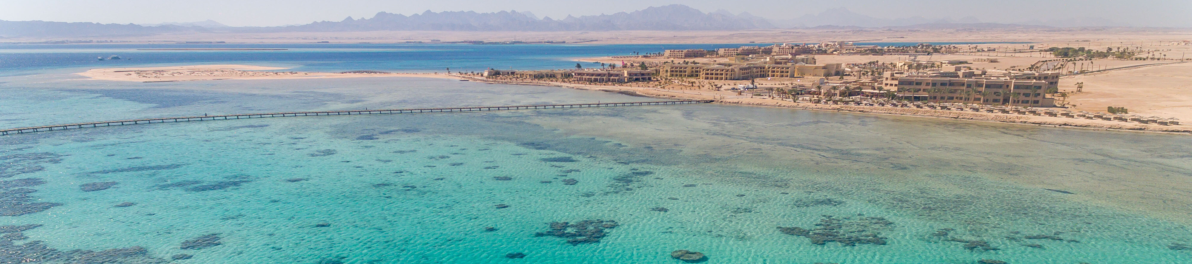 High-resolution aerial view across Somabay’s reef, shoreline and Red Sea peninsula
