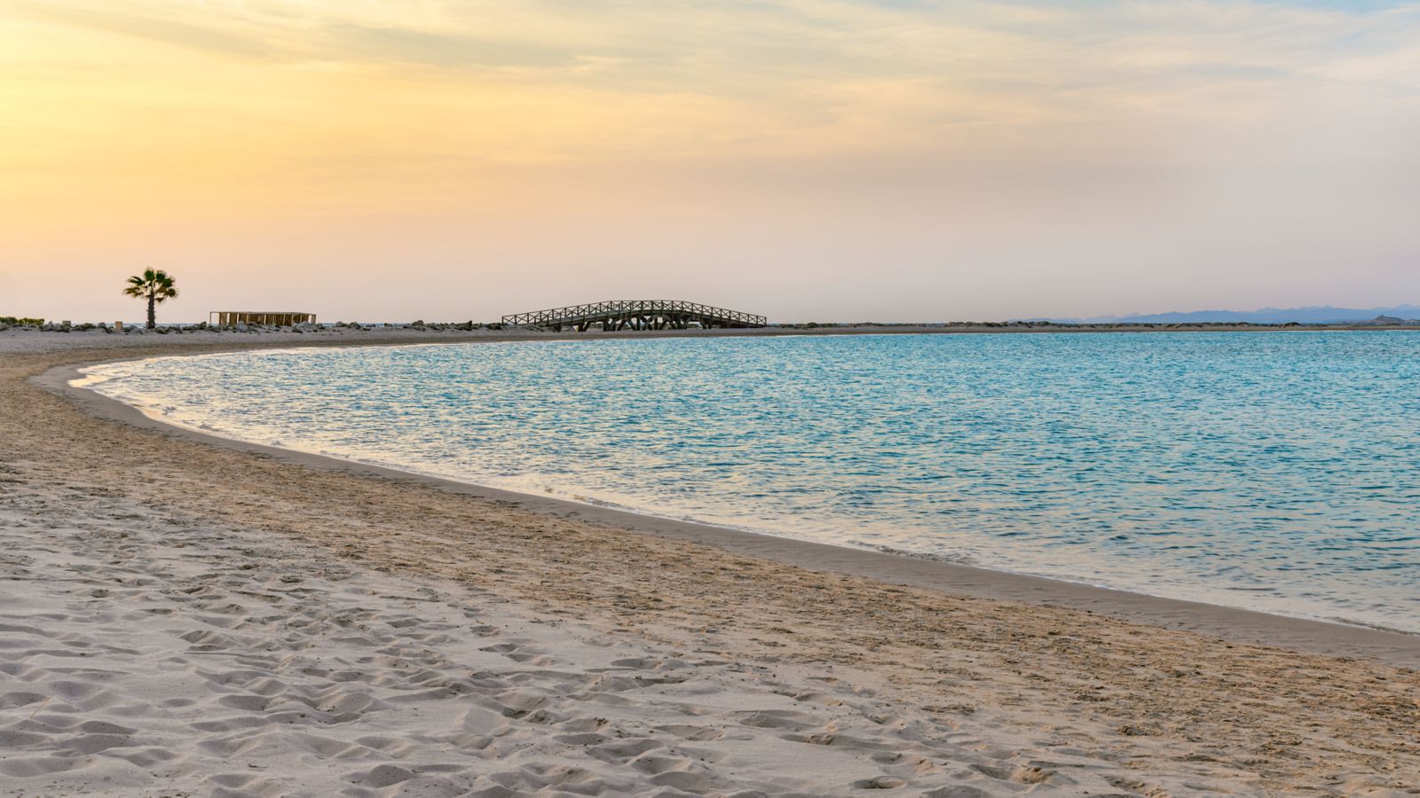 Palm-lined beach and clear Red Sea water at Sheraton Somabay Resort