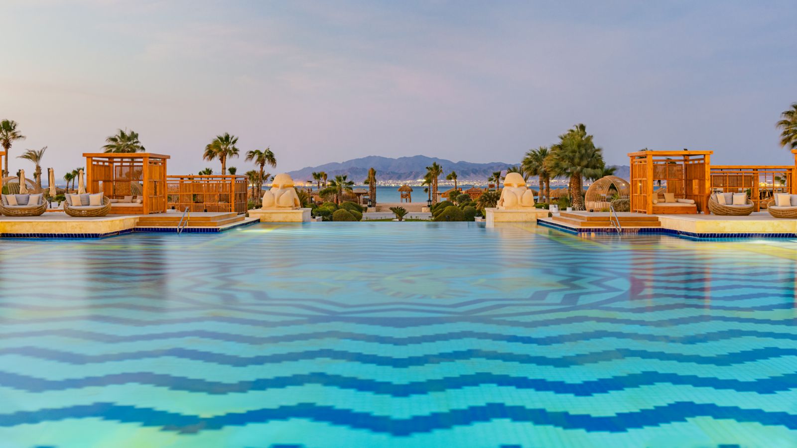Sheraton Somabay swimming pool and palms at dusk